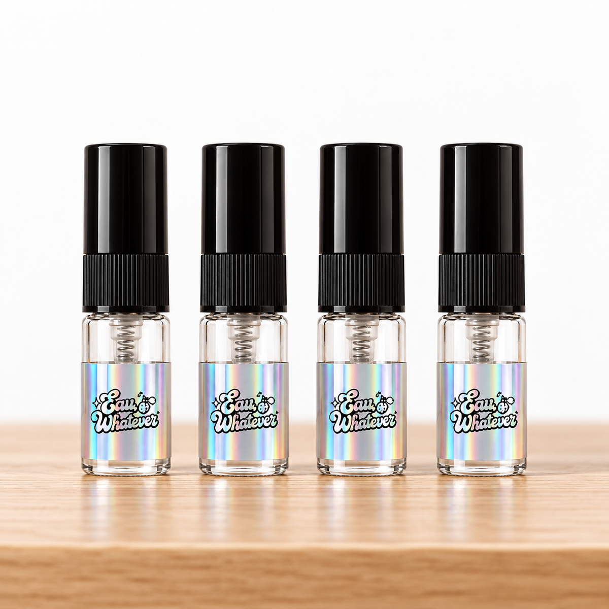 Four 2 mL decants in glass atomizers